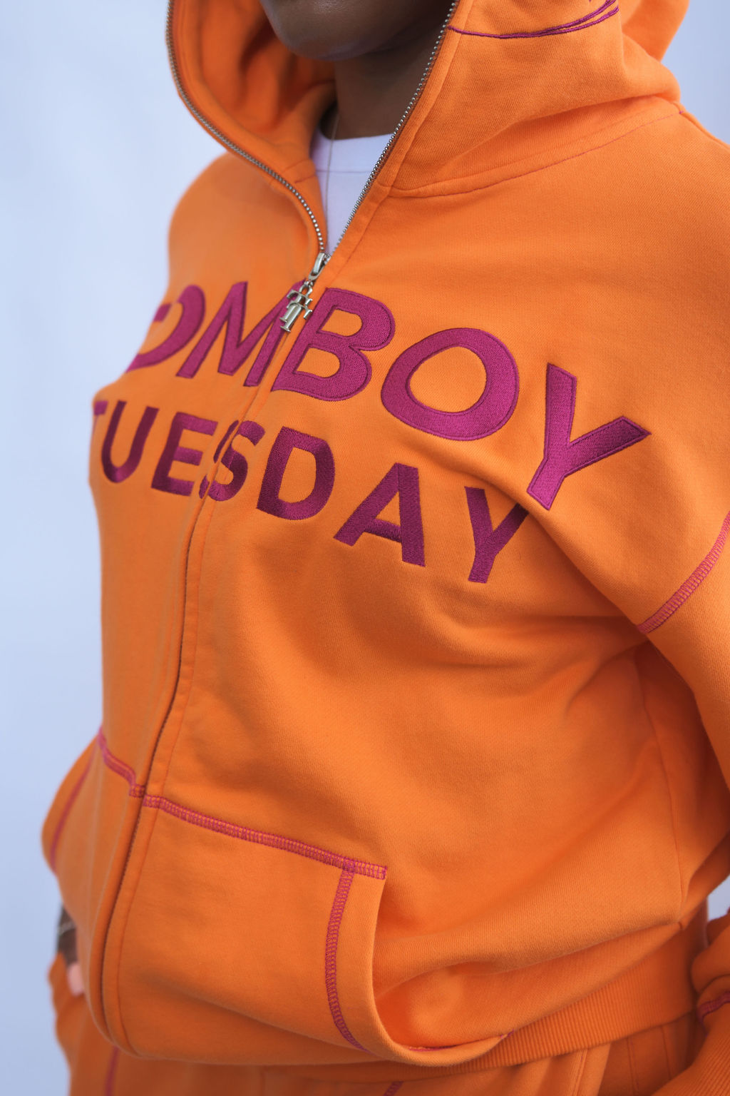 Orange and magenta hoodie with zipper detail